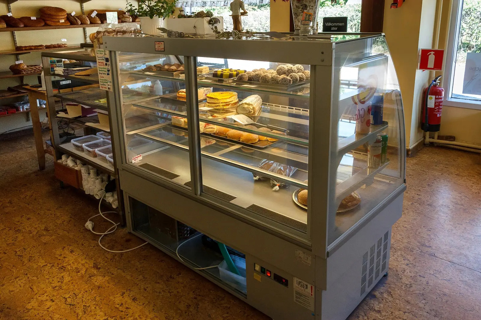Cakes and pastries in a bakery display case. The photo was not taken in Daytona Beach.