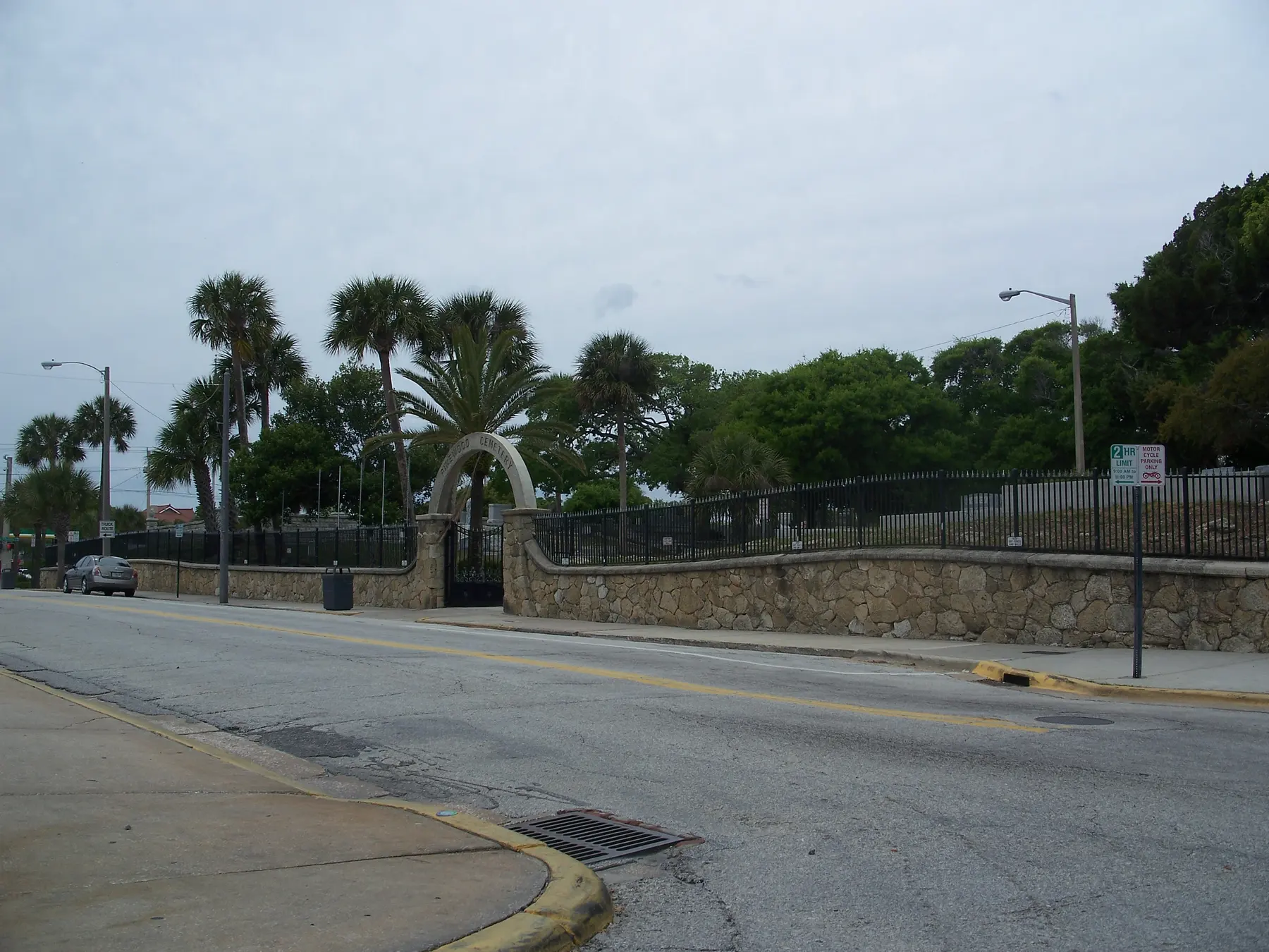 The coquina wall and arched gate of Pinewood Cemetery in the Daytona Beach Surfside Historic District.
